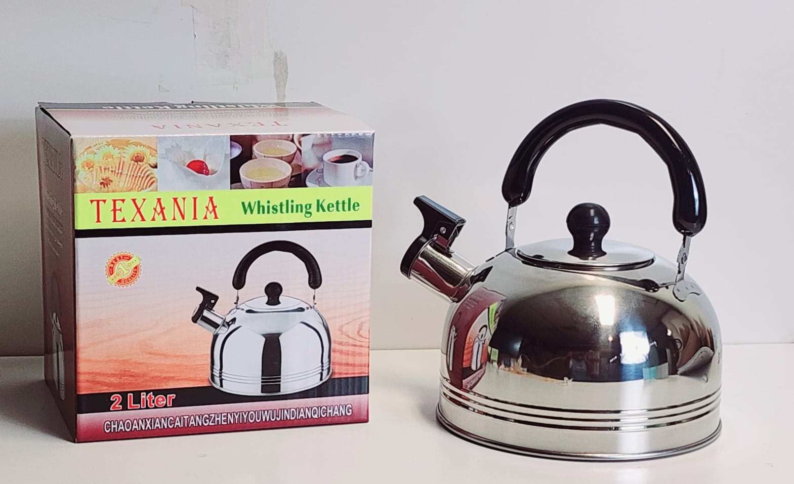 p 20 S10-06 - TEXANIA 2.0 LTR STAINLESS STEEL WHISLING KETTLE - Image 1